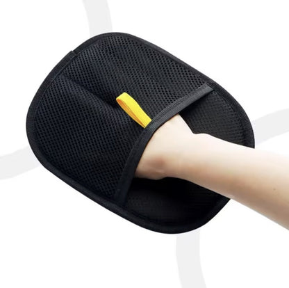 Hand inside the mesh pocket of the pet hair remover mitt
